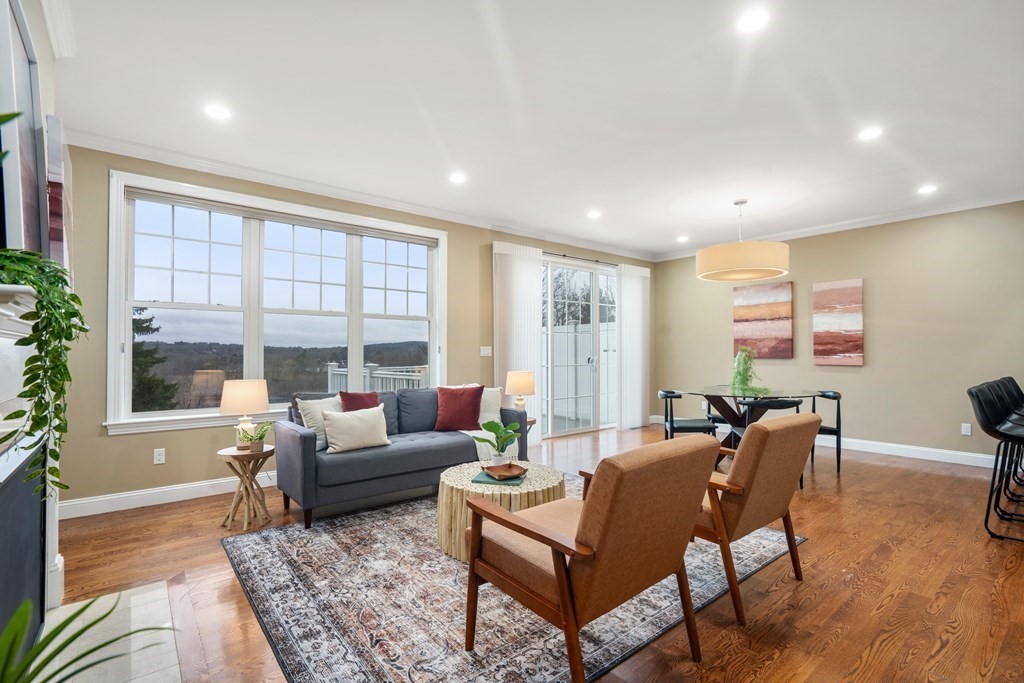 24 Crescent Road, Unit 1 Needham, MA 02494 - Photo 3 of 20 a living room with furniture and a large window