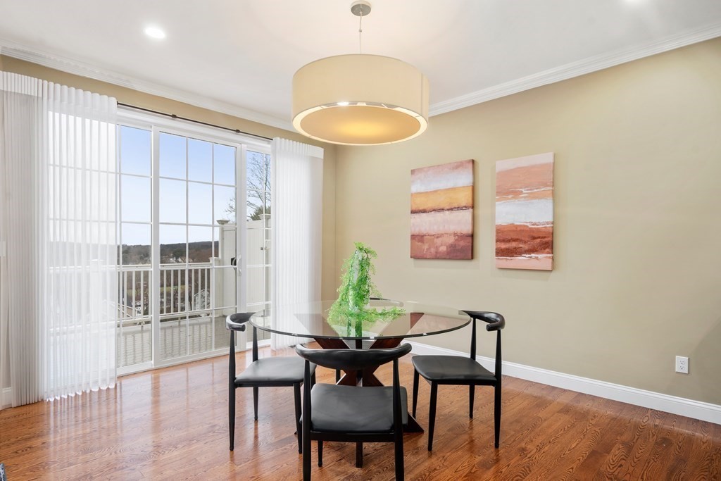 24 Crescent Road, Unit 1 Needham, MA 02494 - Photo 5 of 20 a view of a dining room with furniture and wooden floor