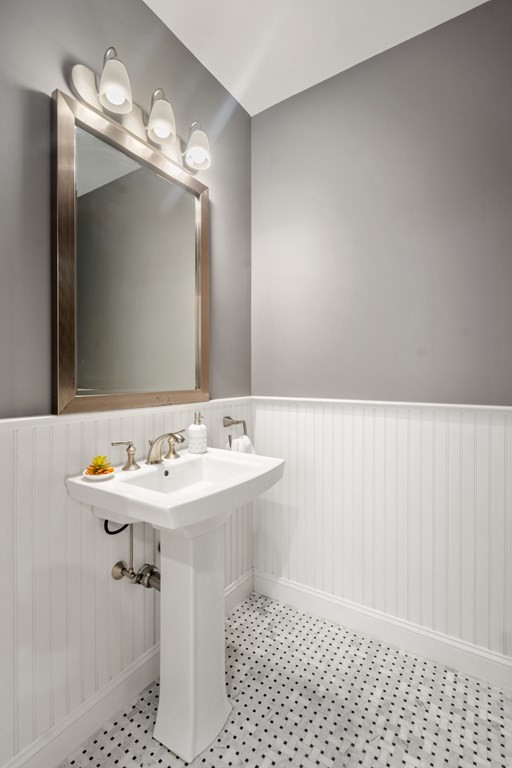 24 Crescent Road, Unit 1 Needham, MA 02494 - Photo 6 of 20 a bathroom with a sink a light fixture and a mirror