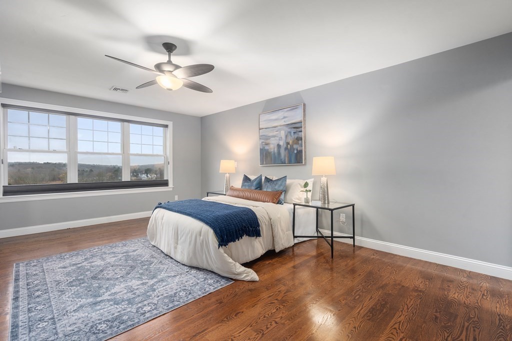 24 Crescent Road, Unit 1 Needham, MA 02494 - Photo 7 of 20 a bedroom with a large bed and a window