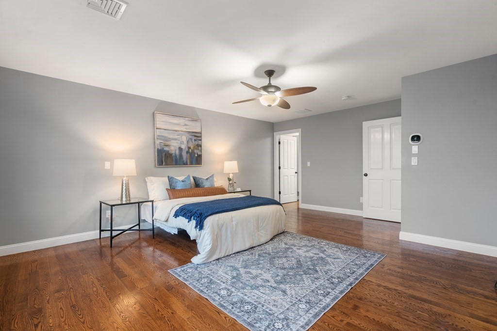 24 Crescent Road, Unit 1 Needham, MA 02494 - Photo 8 of 20 a bedroom with a bed lamps and a dresser