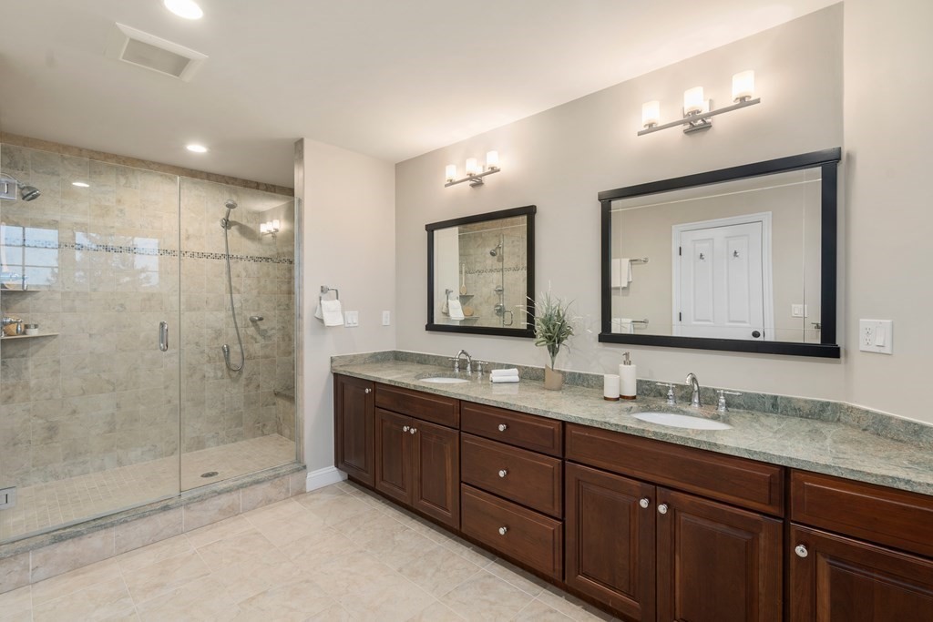 24 Crescent Road, Unit 1 Needham, MA 02494 - Photo 9 of 20 a bathroom with double vanity sinks and a mirror
