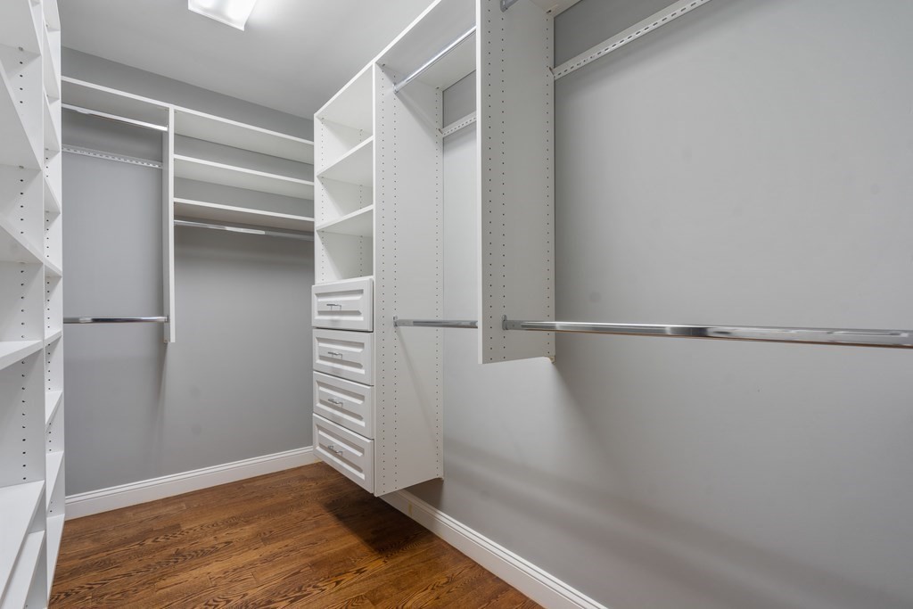 24 Crescent Road, Unit 1 Needham, MA 02494 - Photo 10 of 20 a view of walk in closet with empty racks