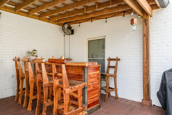 a patio with table and chairs