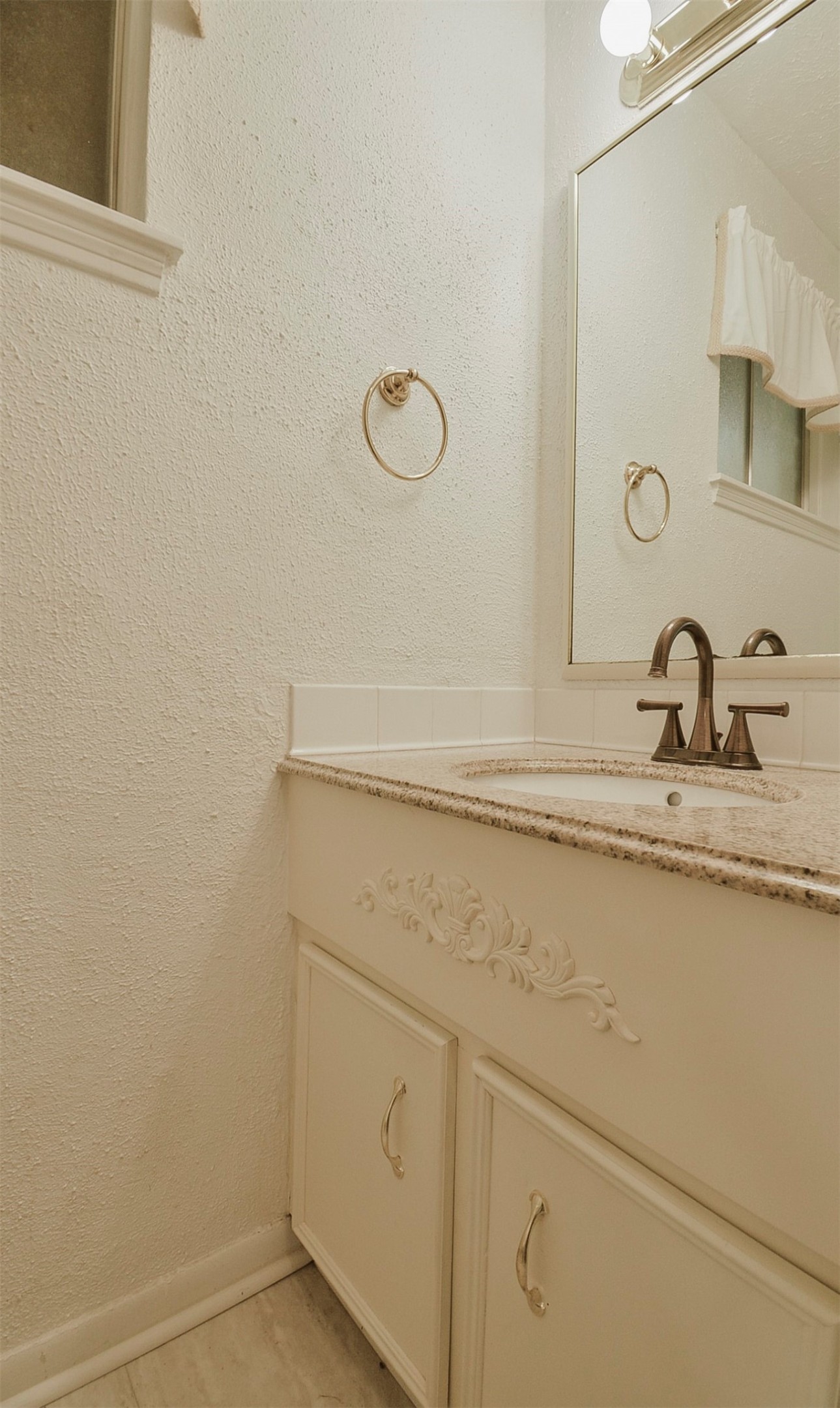 13915 Roundstone Lane Houston, TX 77015 - Photo 19 of 42 a bathroom with a sink and mirror
