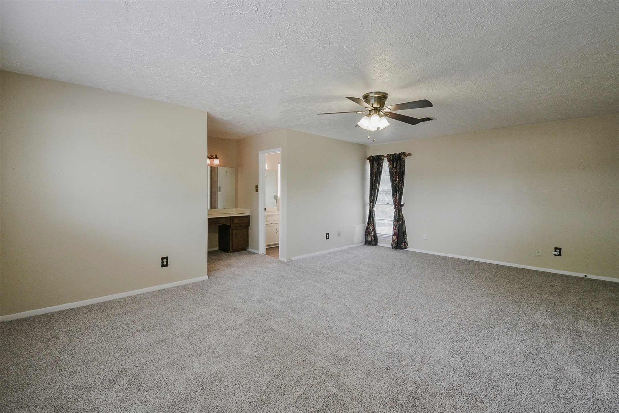 13915 Roundstone Lane Houston, TX 77015 - Photo 28 of 42 a view of an empty room with chandelier fan