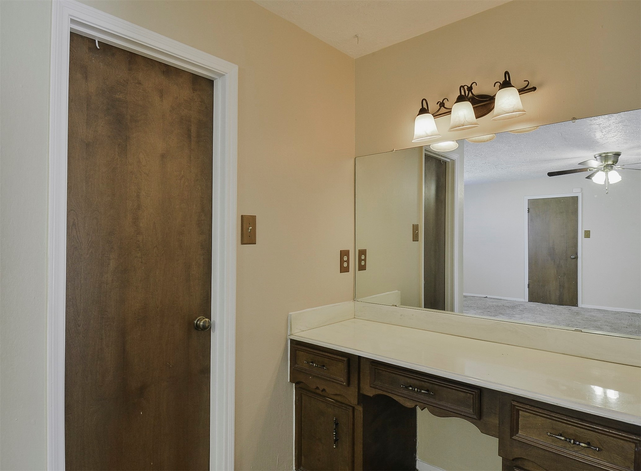 13915 Roundstone Lane Houston, TX 77015 - Photo 31 of 42 a bathroom with a sink vanity and a mirror