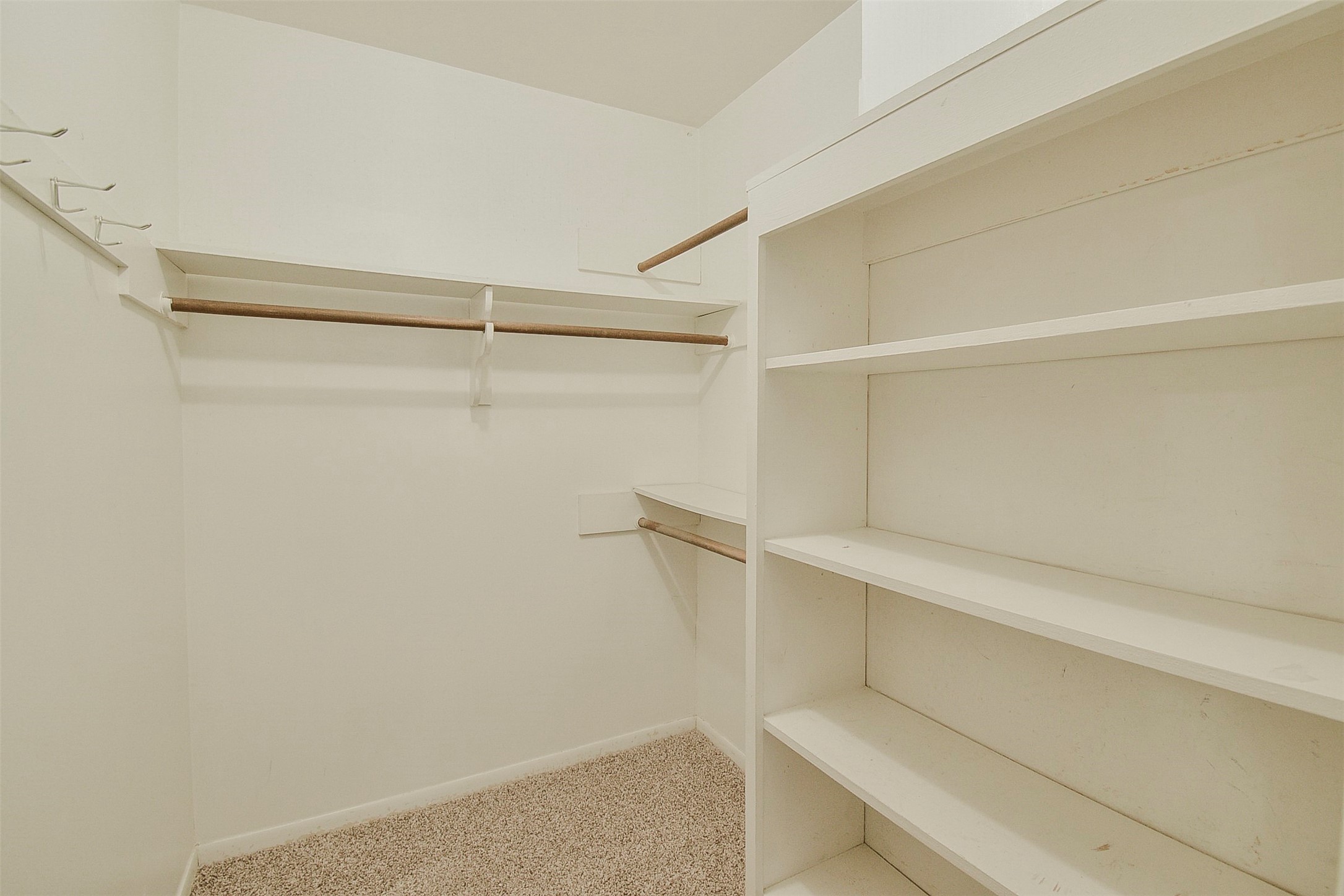13915 Roundstone Lane Houston, TX 77015 - Photo 32 of 42 a view of an empty walk in closet