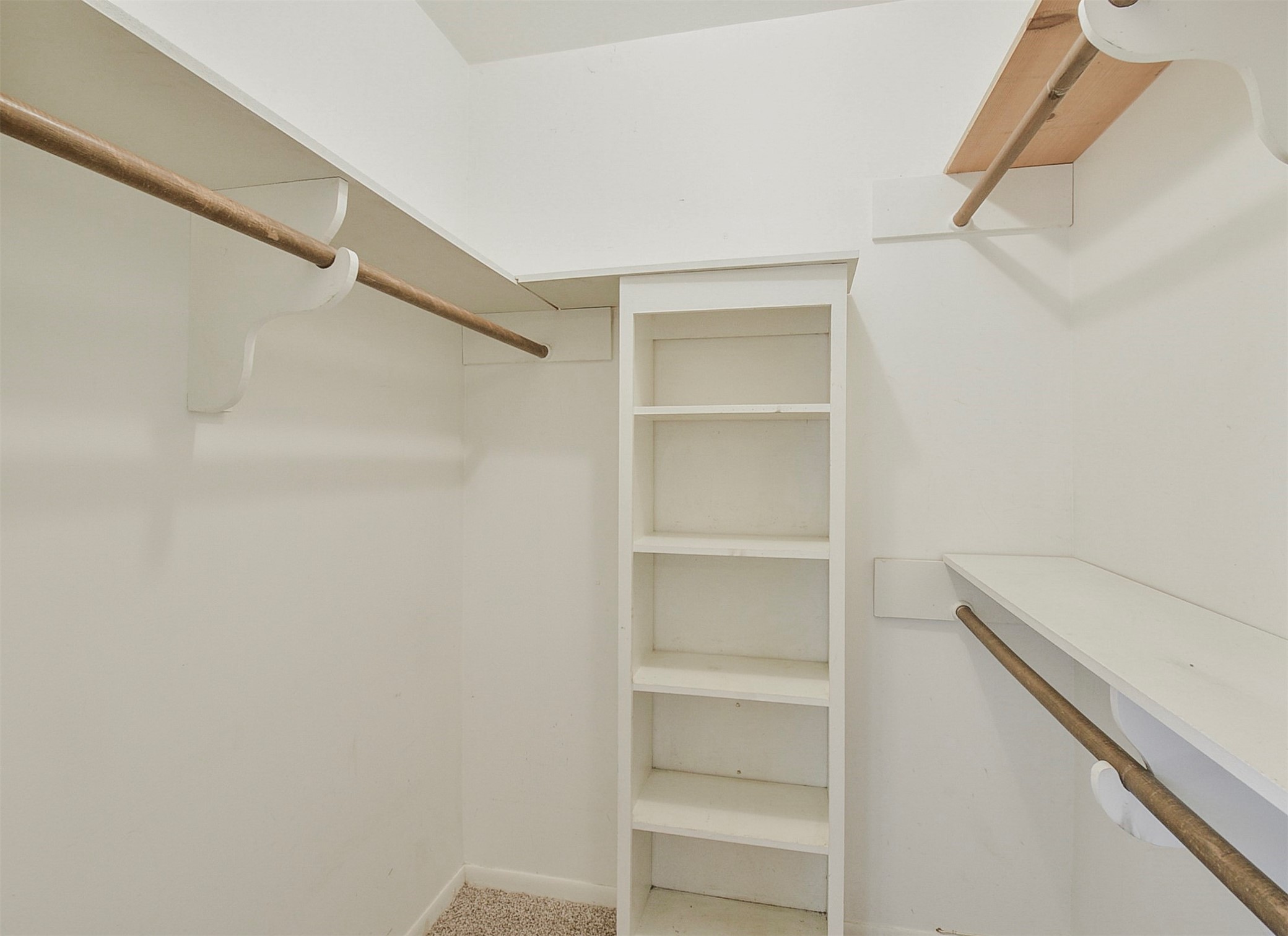 13915 Roundstone Lane Houston, TX 77015 - Photo 35 of 42 a view of walk in closet with empty racks