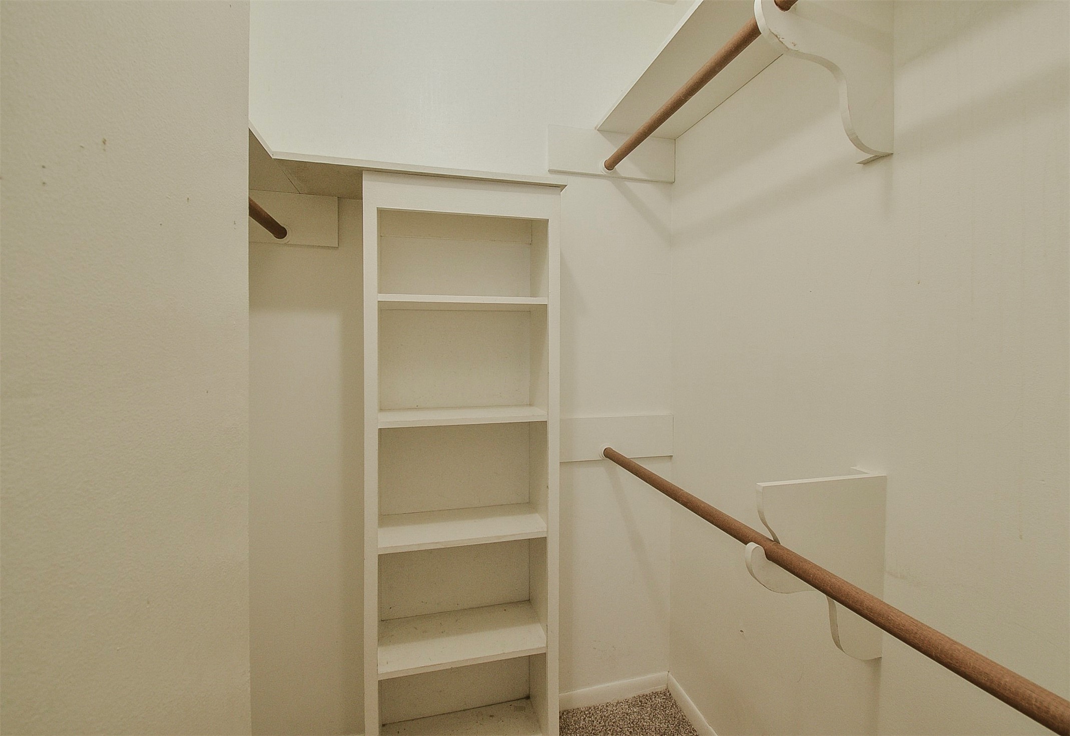 13915 Roundstone Lane Houston, TX 77015 - Photo 38 of 42 a view of walk in closet with empty racks