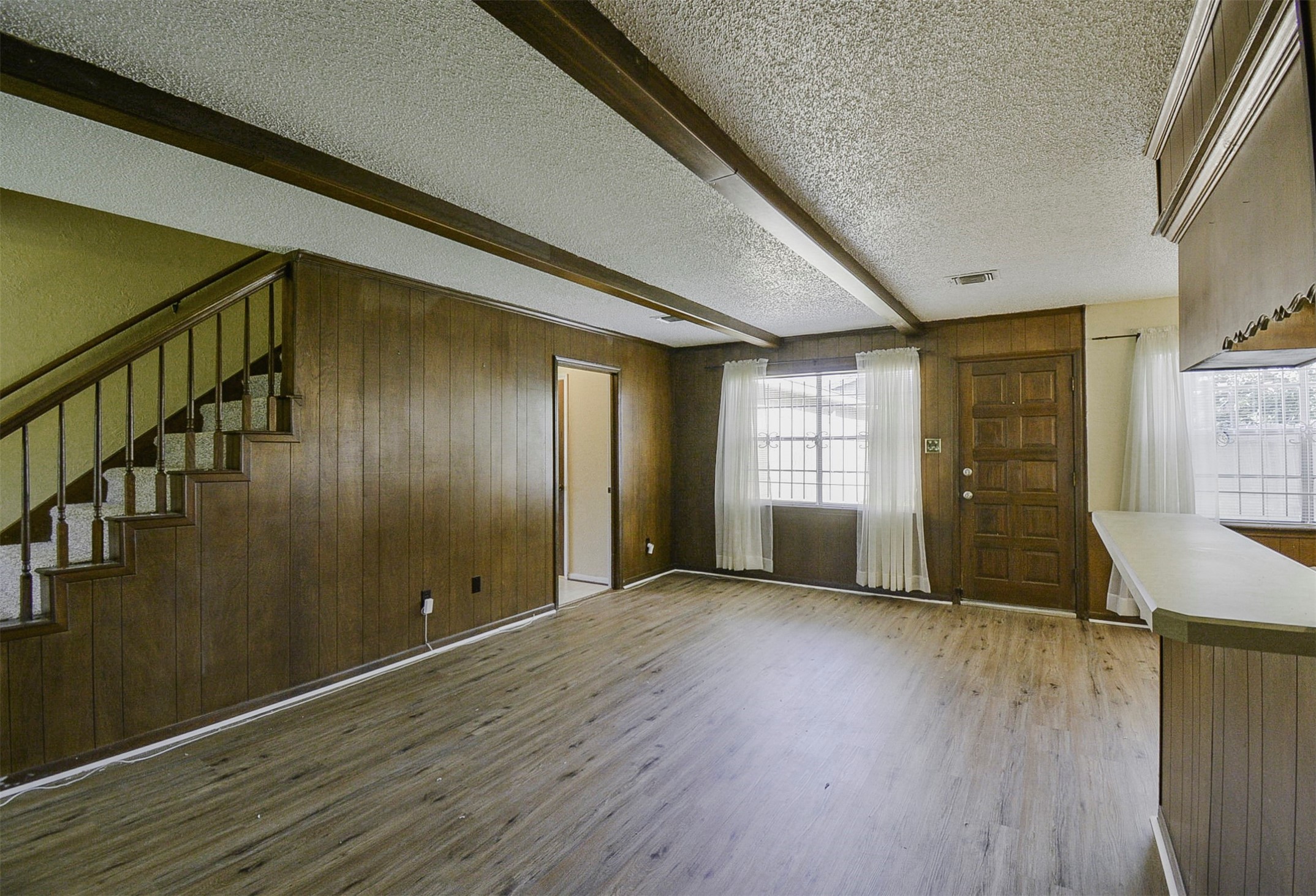 13915 Roundstone Lane Houston, TX 77015 - Photo 7 of 42 a view of empty room with wooden floor and fan