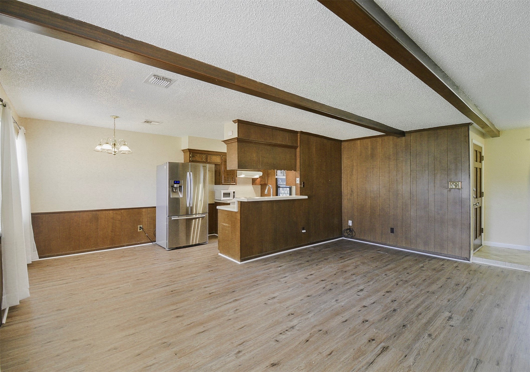 13915 Roundstone Lane Houston, TX 77015 - Photo 8 of 42 a view of empty room with wooden floor