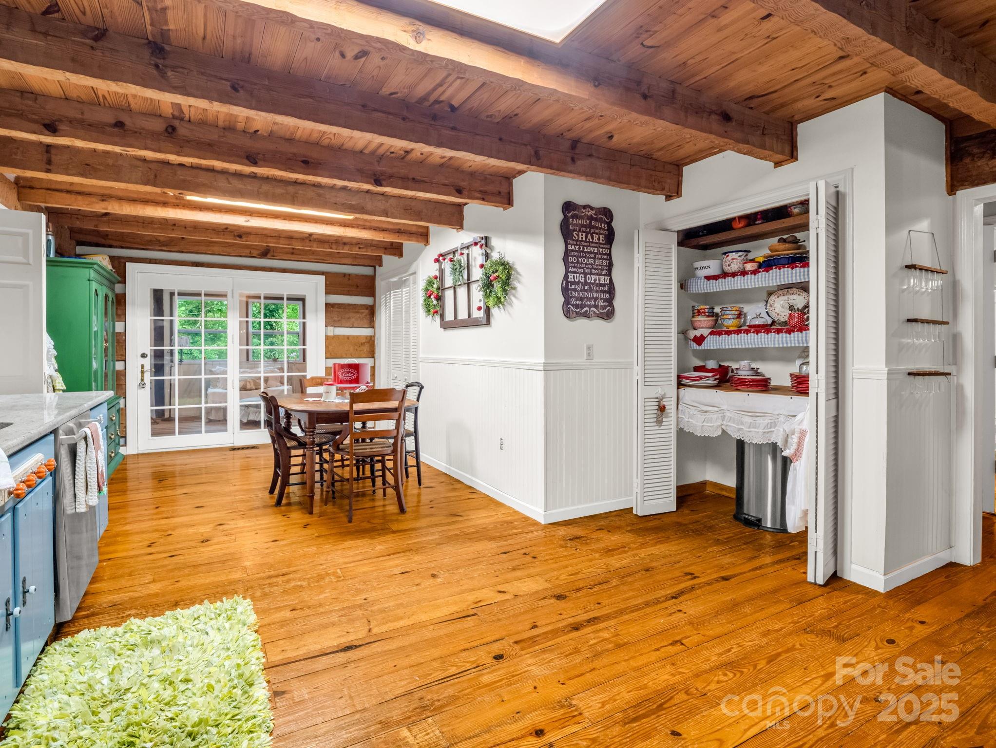 1145 Bearwallow Mountain Road Hendersonville, NC 28792 - Photo 22 of 48 a view of a livingroom with furniture and a dinning area