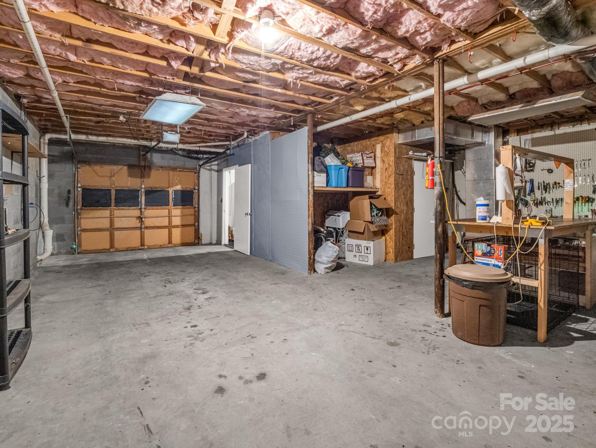1145 Bearwallow Mountain Road Hendersonville, NC 28792 - Photo 37 of 48 a view of a storage room with racks