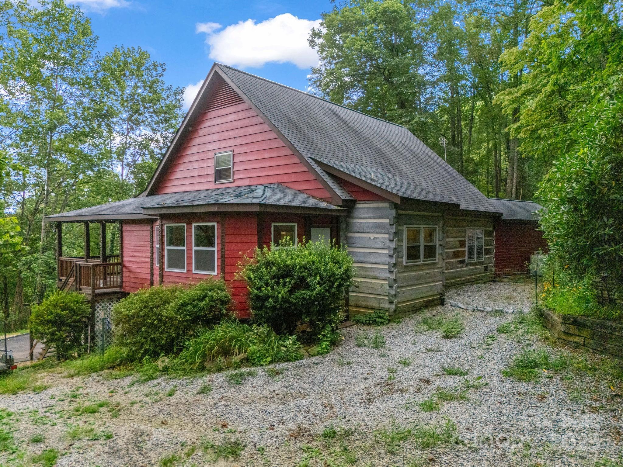 1145 Bearwallow Mountain Road Hendersonville, NC 28792 - Photo 39 of 48 a front view of a house with garden