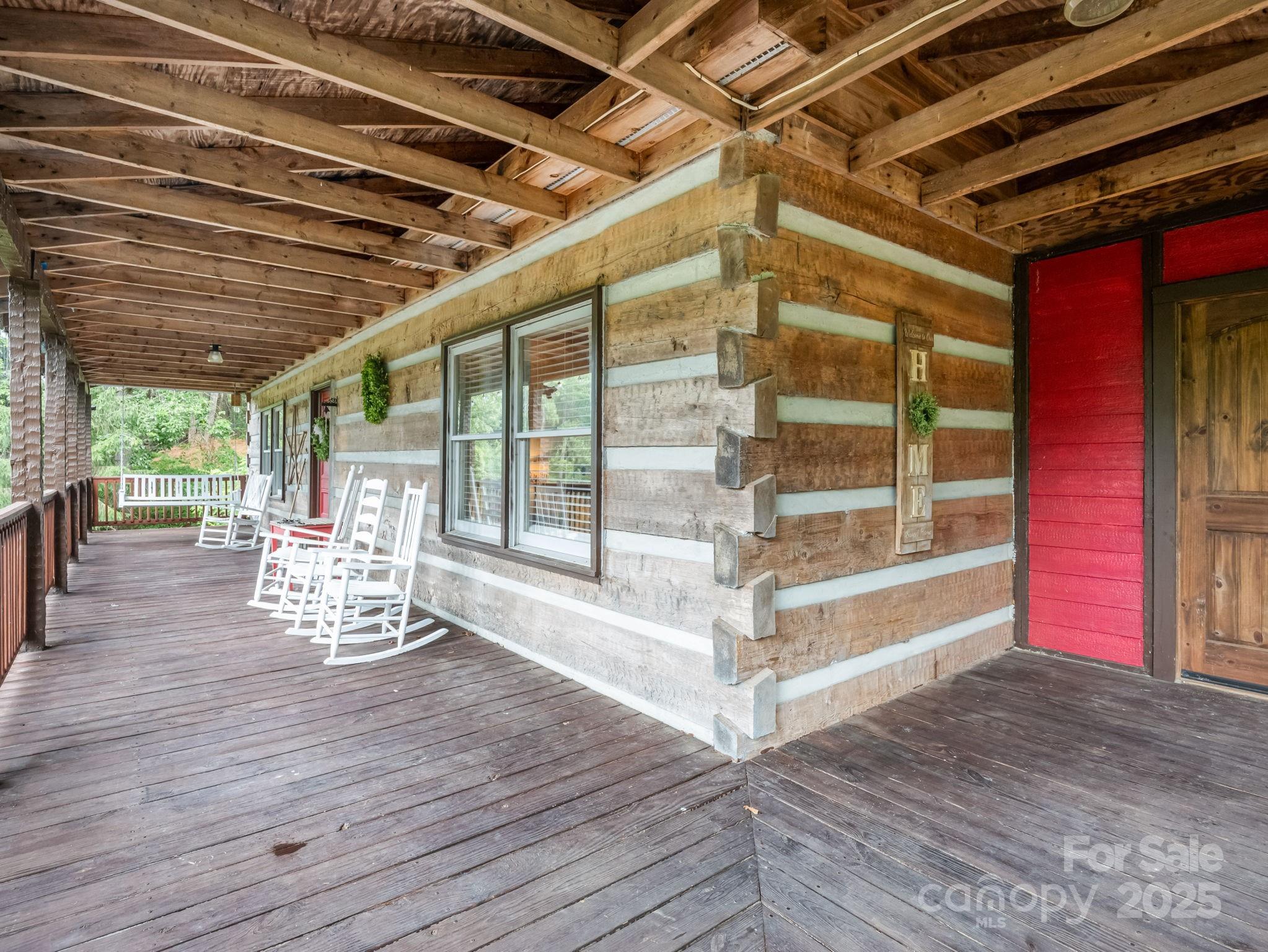 1145 Bearwallow Mountain Road Hendersonville, NC 28792 - Photo 4 of 48 a view of steet room with wooden floor and iron stairs