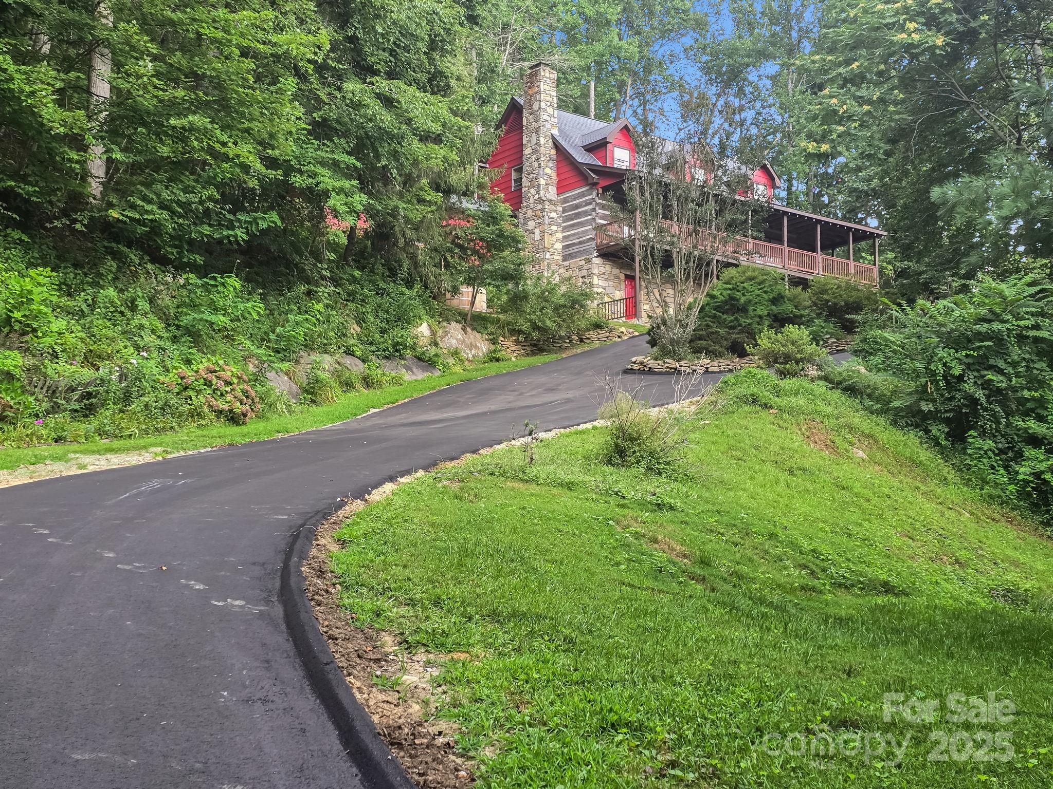 1145 Bearwallow Mountain Road Hendersonville, NC 28792 - Photo 5 of 48 a view of a back yard of the house