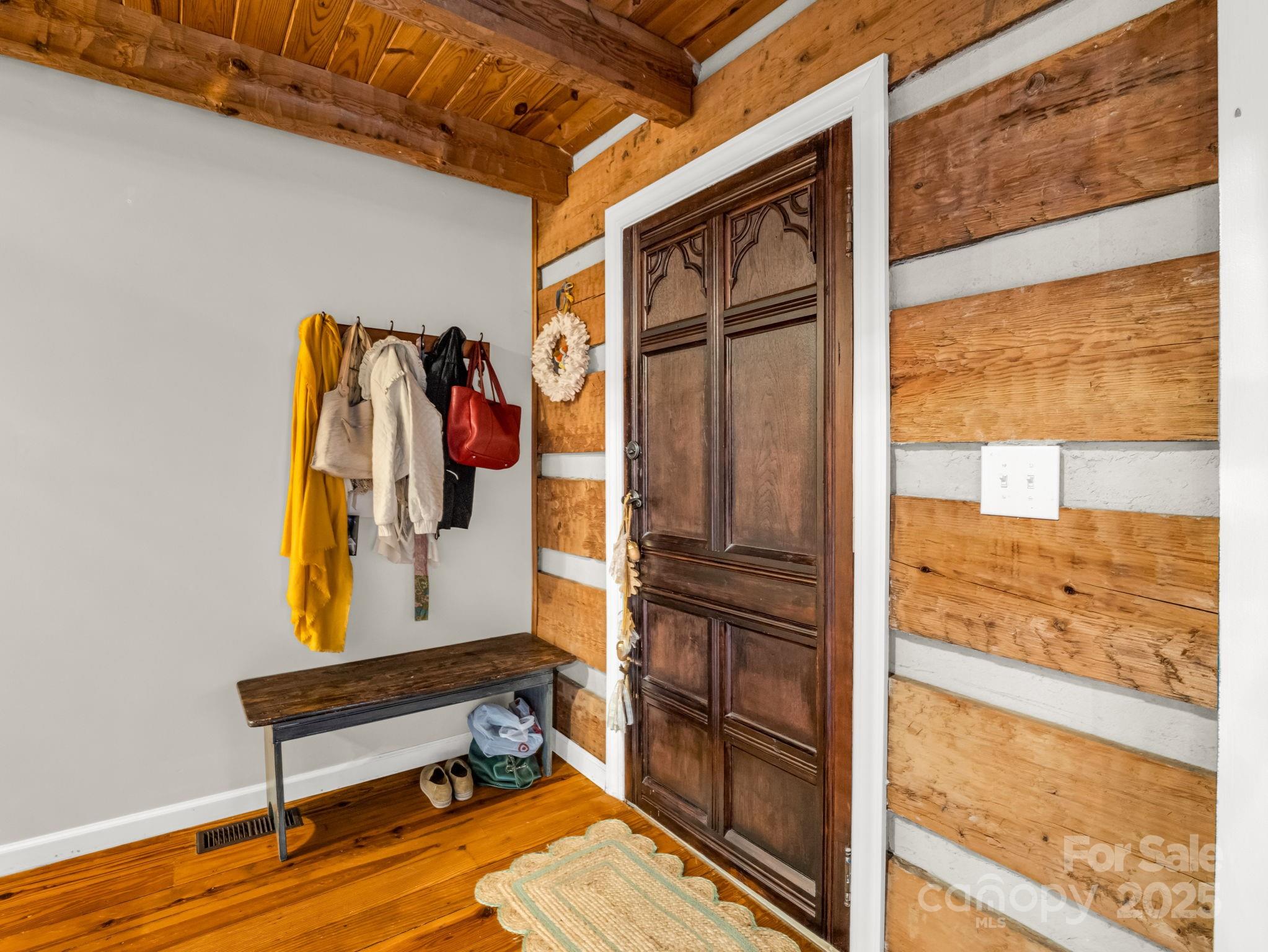1145 Bearwallow Mountain Road Hendersonville, NC 28792 - Photo 8 of 48 a view of walk in closet with clothes and shoes