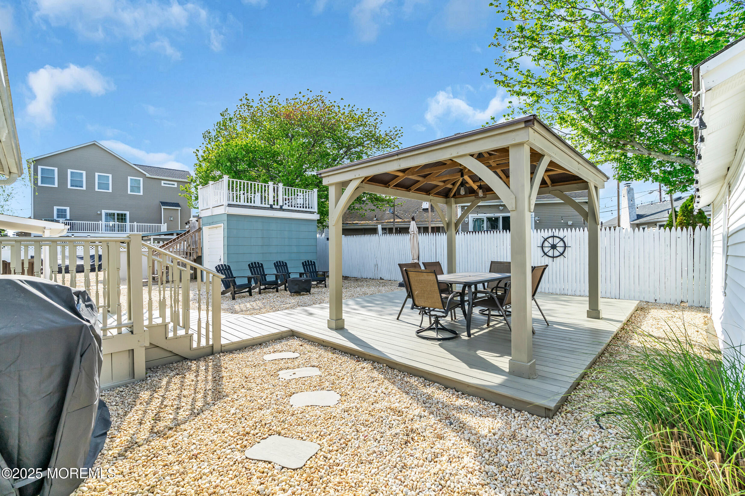 124 Mathis Drive Brick, NJ 08723 - Photo 26 of 45 a view of a house with backyard patio and sitting area