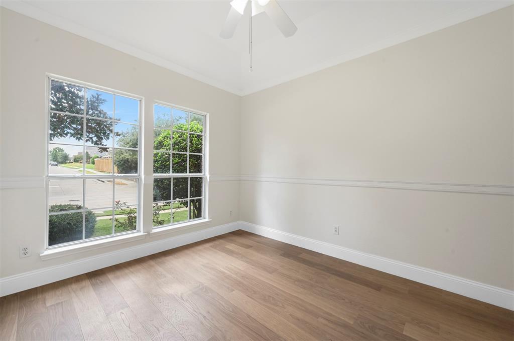 4524 Ridgepointe Drive The Colony, TX 75056 - Photo 21 of 25 a view of a room with wooden floor and large window