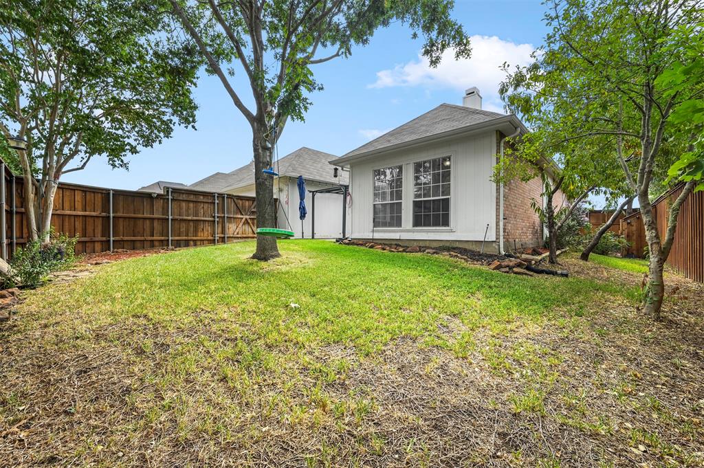 4524 Ridgepointe Drive The Colony, TX 75056 - Photo 24 of 25 a view of a house with a yard and sitting area
