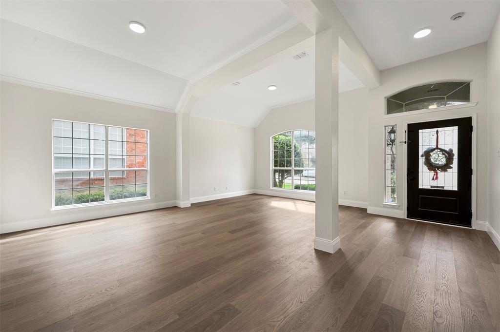 4524 Ridgepointe Drive The Colony, TX 75056 - Photo 3 of 25 an empty room with wooden floor and windows