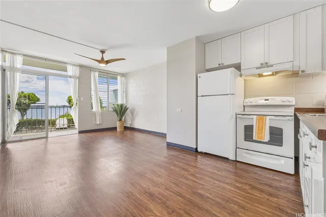 a view of kitchen with furniture and wooden floor