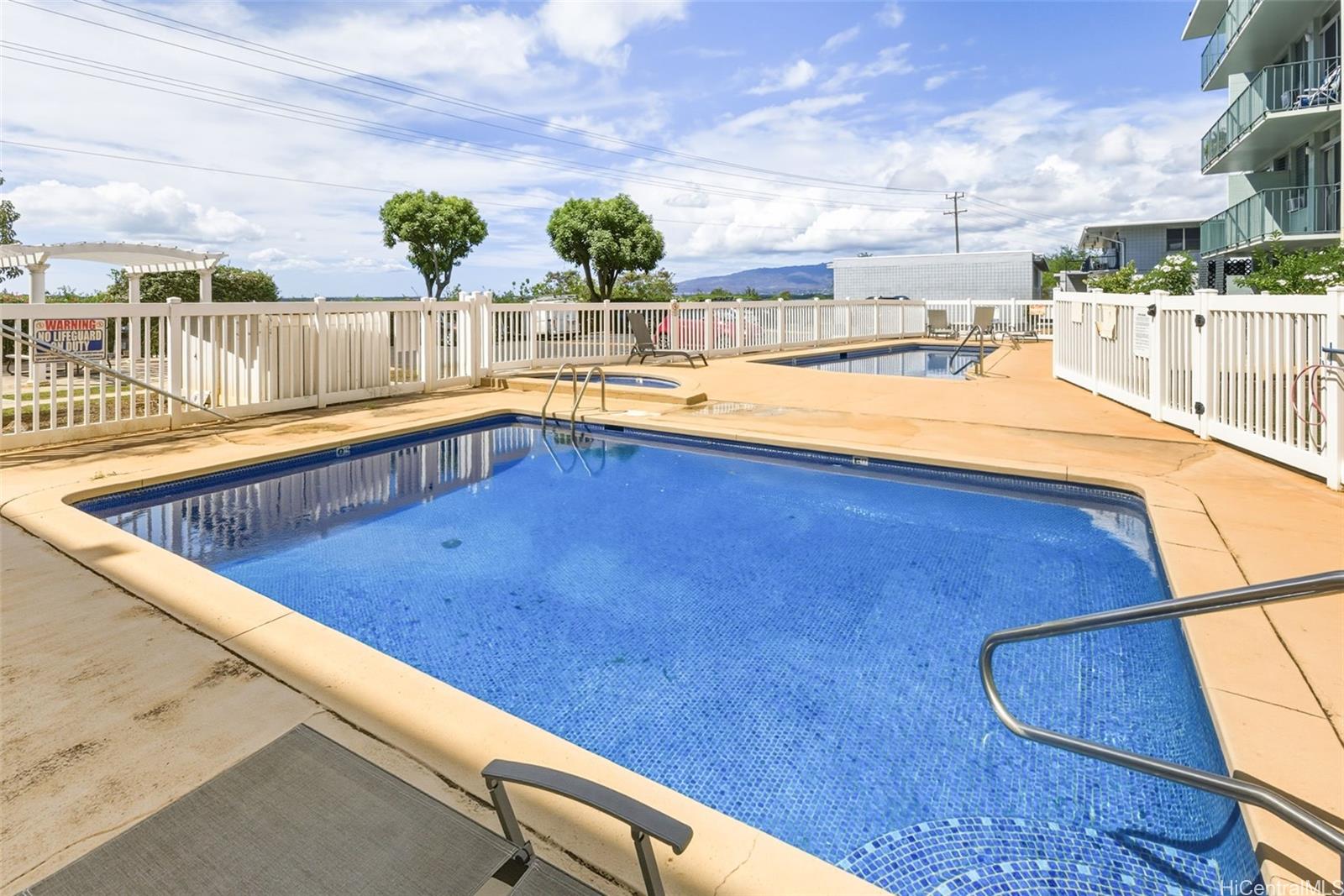 98-135 Lipoa Place, Unit 208 Aiea, HI 96701 - Photo 16 of 22 a view of outdoor space and swimming pool