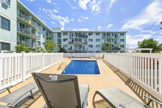 a view of a swimming pool with a patio