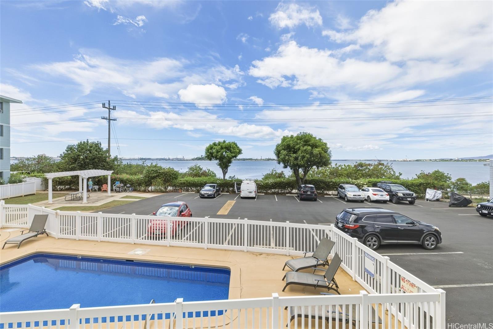 98-135 Lipoa Place, Unit 208 Aiea, HI 96701 - Photo 19 of 22 a view of a balcony with an ocean view