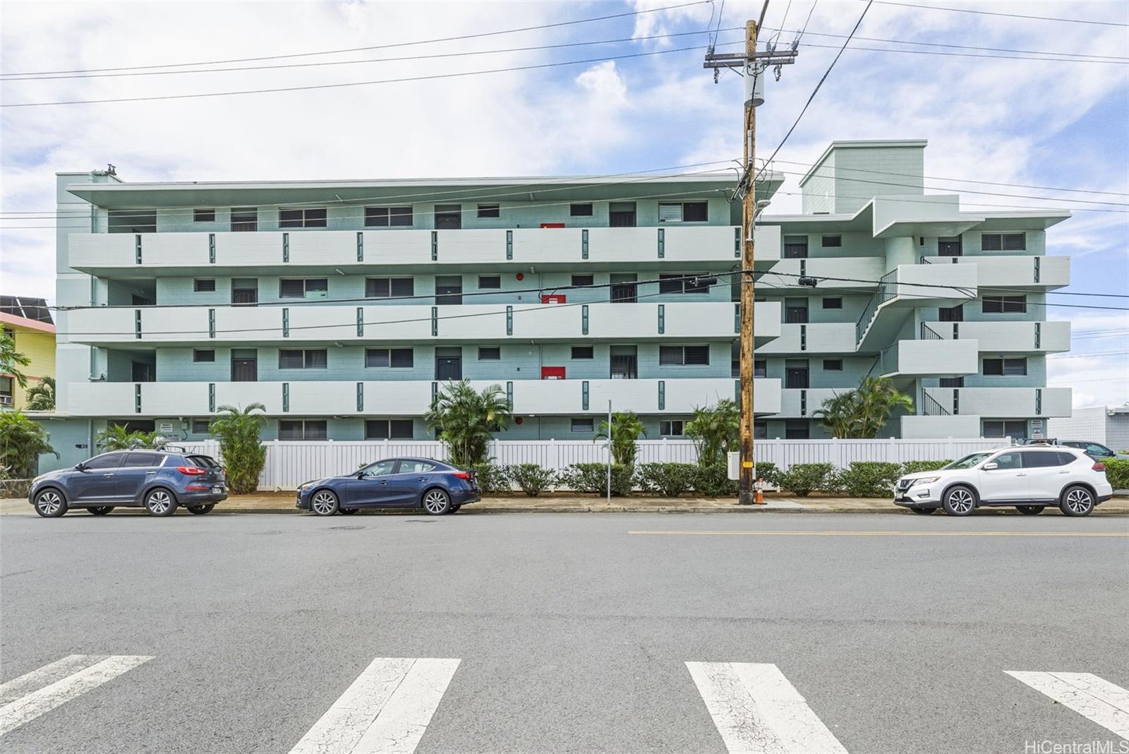 98-135 Lipoa Place, Unit 208 Aiea, HI 96701 - Photo 22 of 22 a car parked in front of a building