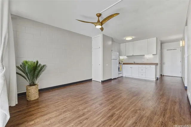 a view of a kitchen with a sink and a potted plant