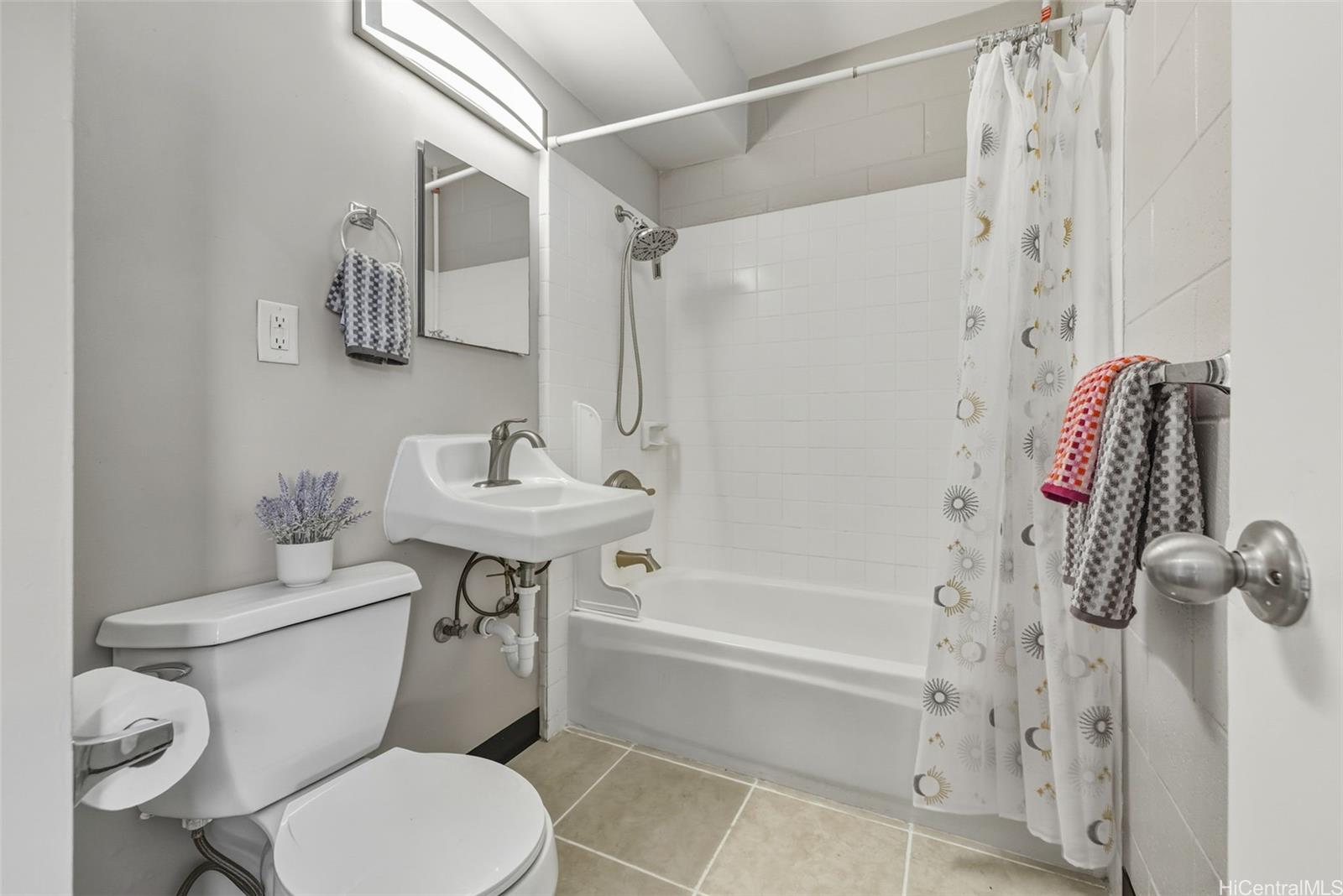 98-135 Lipoa Place, Unit 208 Aiea, HI 96701 - Photo 10 of 22 a bathroom with a sink toilet and shower