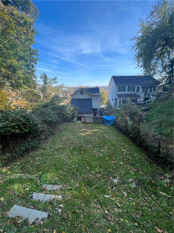 433 Henry Street McKees Rocks, PA 15136 - Photo 24 of 25 a view of a big house with a big yard and large trees
