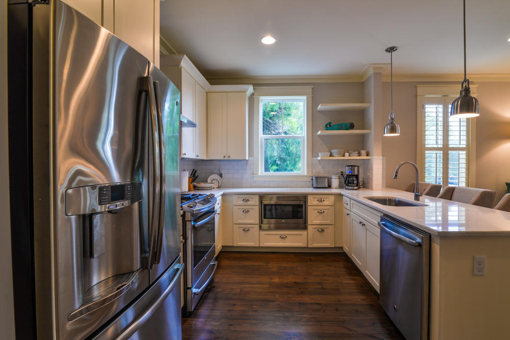 59 Pontchartrain North Santa Rosa Beach, FL 32459 - Photo 11 of 43 a kitchen with stainless steel appliances granite countertop a refrigerator a stove a sink and a window