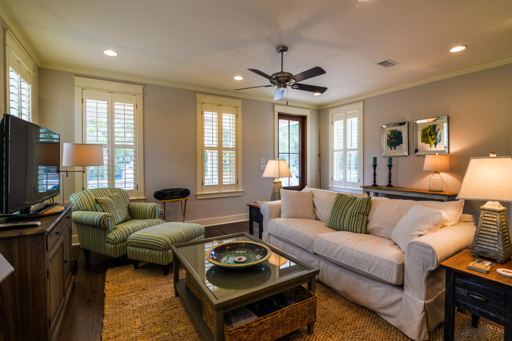 59 Pontchartrain North Santa Rosa Beach, FL 32459 - Photo 6 of 43 a living room with furniture a ceiling fan and a flat screen tv