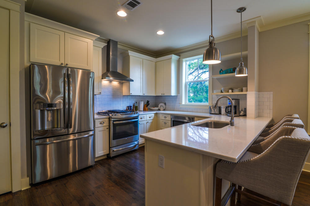 59 Pontchartrain North Santa Rosa Beach, FL 32459 - Photo 9 of 43 a kitchen with a refrigerator a sink dishwasher a stove and a refrigerator with wooden floor