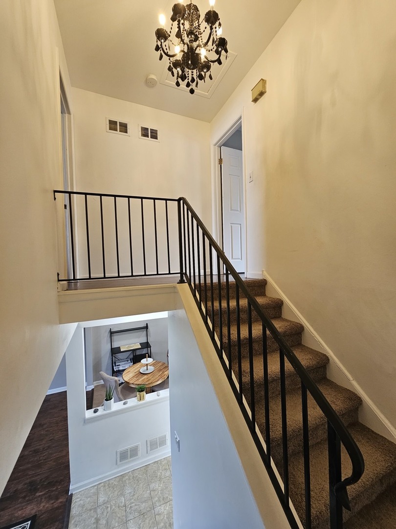 608 Bayview Point Schaumburg, IL 60194 - Photo 18 of 31 a view of entryway with wooden floor