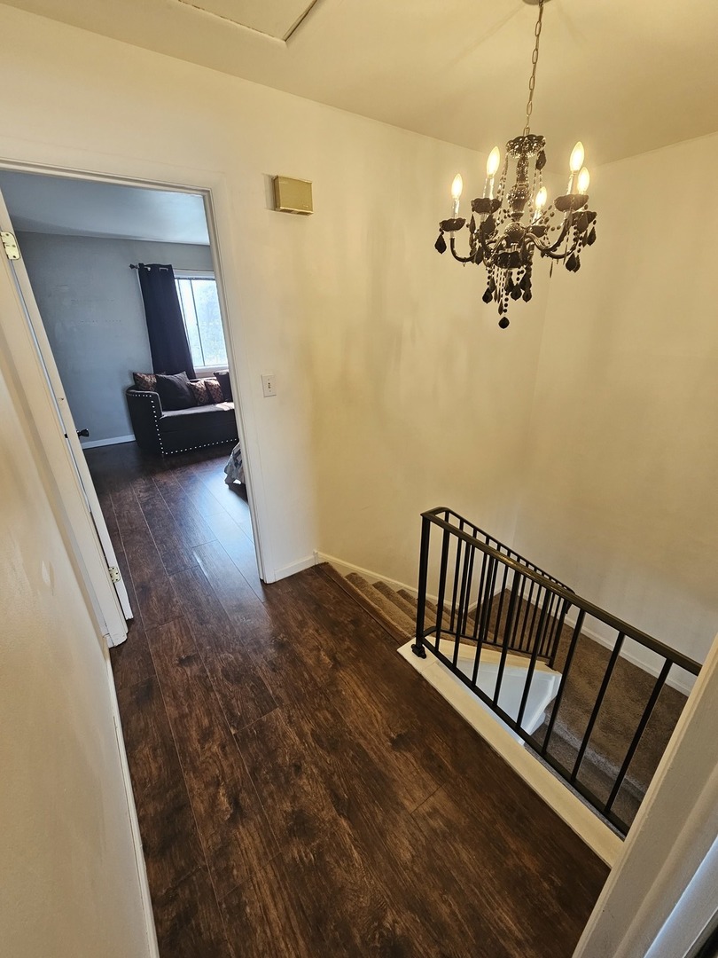 608 Bayview Point Schaumburg, IL 60194 - Photo 24 of 31 a view of a hallway with a chandelier
