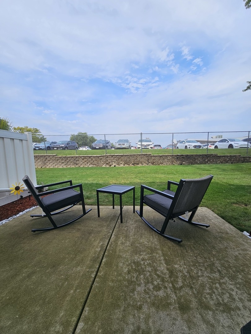 608 Bayview Point Schaumburg, IL 60194 - Photo 26 of 31 an outdoor sitting area with couch and a table