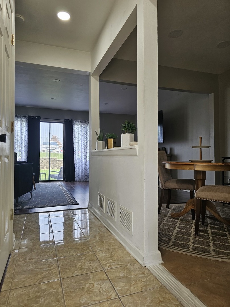 608 Bayview Point Schaumburg, IL 60194 - Photo 5 of 31 a room with lots of furniture and a rug