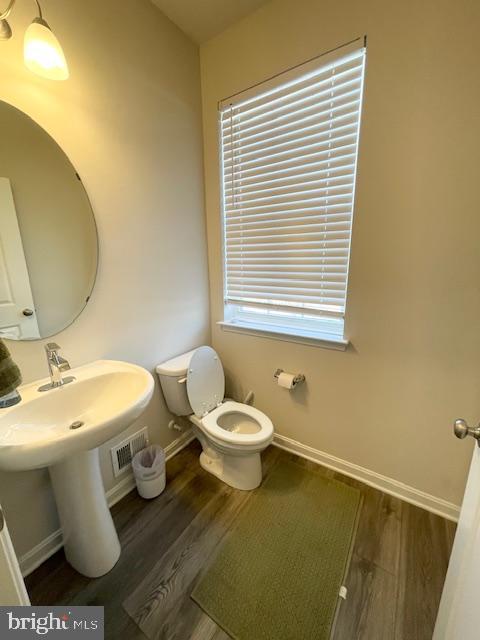8804 Woodyard Station Road Clinton, MD 20735 - Photo 18 of 39 a bathroom with a sink and a toilet
