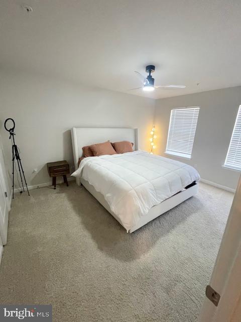 8804 Woodyard Station Road Clinton, MD 20735 - Photo 22 of 39 a bedroom with a bed and a lamp