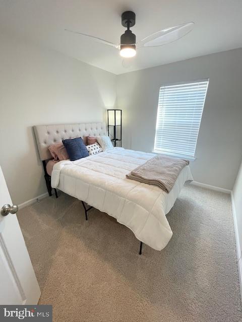 8804 Woodyard Station Road Clinton, MD 20735 - Photo 27 of 39 a bedroom with a bed and a chandelier