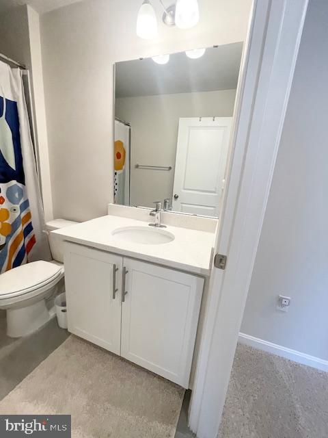 8804 Woodyard Station Road Clinton, MD 20735 - Photo 32 of 39 a bathroom with a sink vanity mirror and toilet