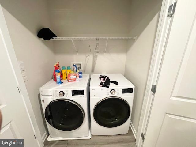 8804 Woodyard Station Road Clinton, MD 20735 - Photo 33 of 39 a utility room with dryer and washer