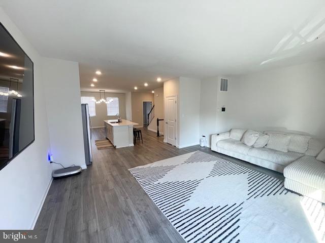 8804 Woodyard Station Road Clinton, MD 20735 - Photo 7 of 39 a living room with furniture and a wooden floor