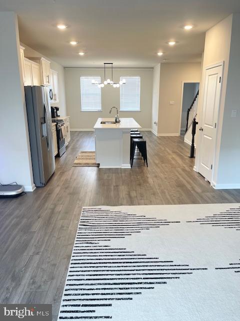 8804 Woodyard Station Road Clinton, MD 20735 - Photo 9 of 39 a living room with stainless steel appliances furniture a refrigerator and a kitchen view