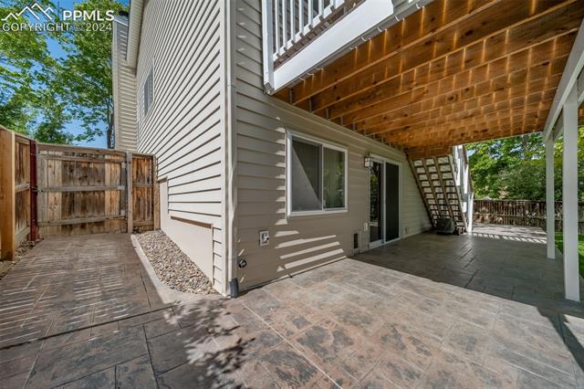 263 Southpark Road Highlands Ranch, CO 80126 - Photo 37 of 42 Lovely stamped concrete patio wraps around the back of the house