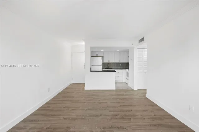 a view of kitchen with wooden floor